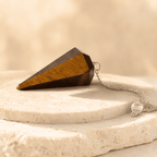 Tiger’s Eye Faceted Crystal Pendulum – Thorn & Thimble