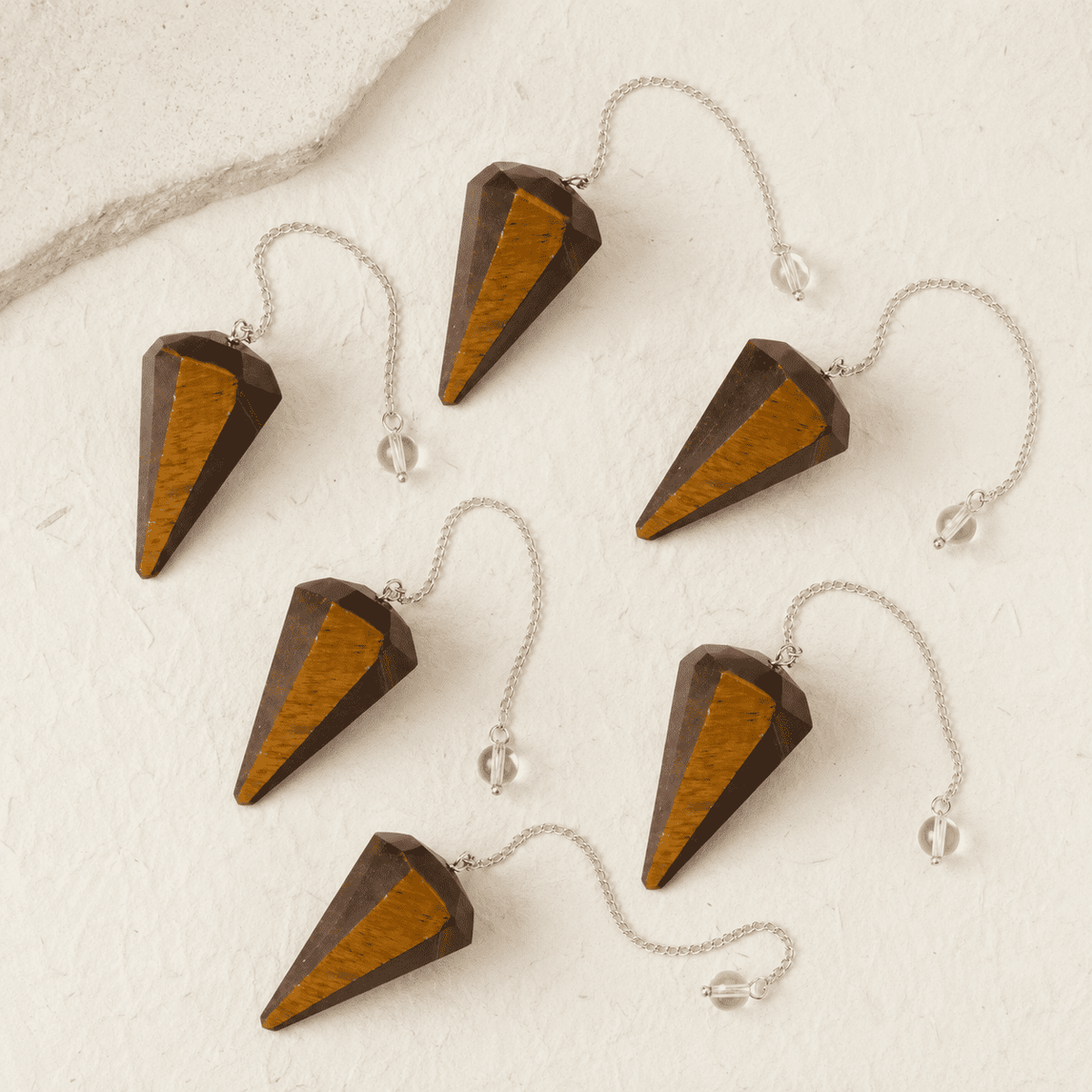Tiger’s Eye Faceted Crystal Pendulum – Thorn & Thimble